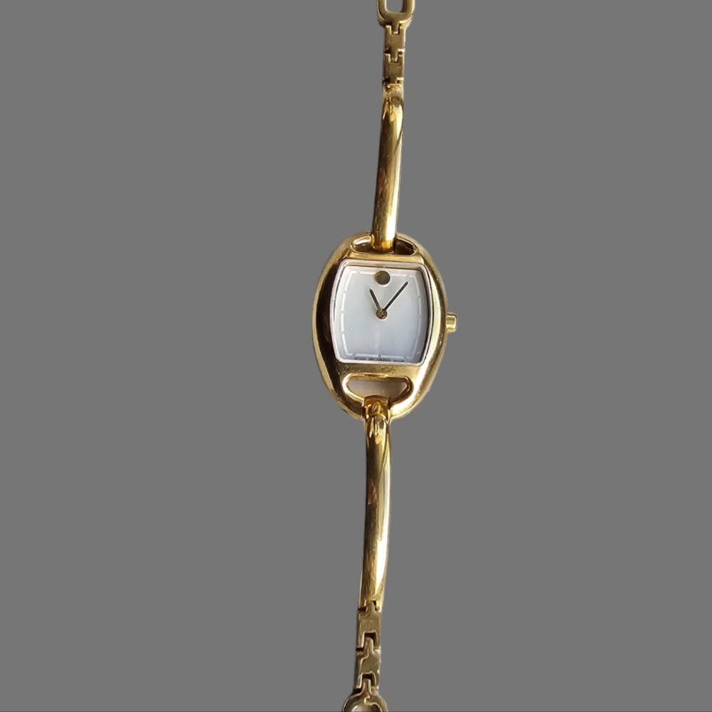 Movado Miri (0606608 Mother of Pearl Dial Gold Tone Women's Oval Watch. See Desc